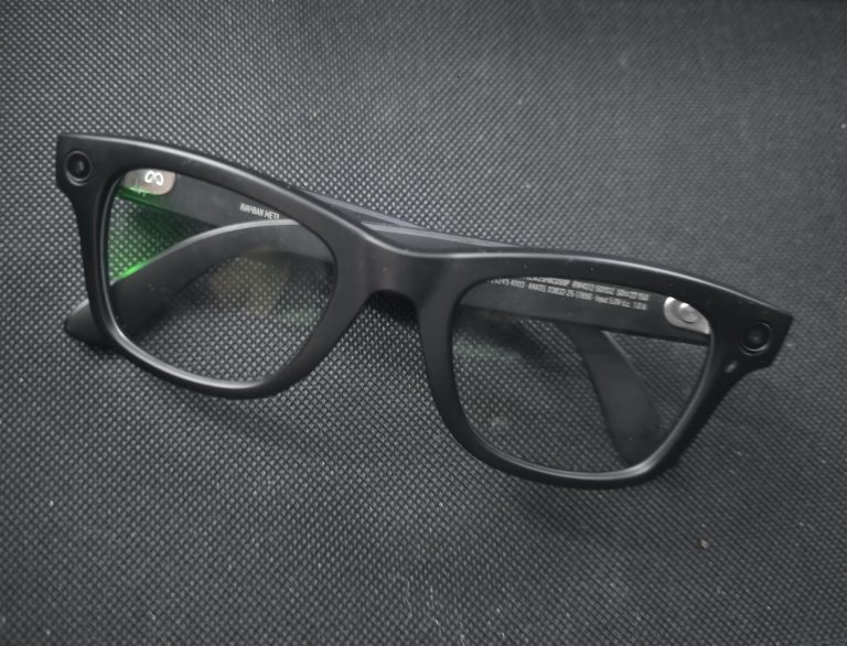 A pair of dead smart glasses lying in a drawer.