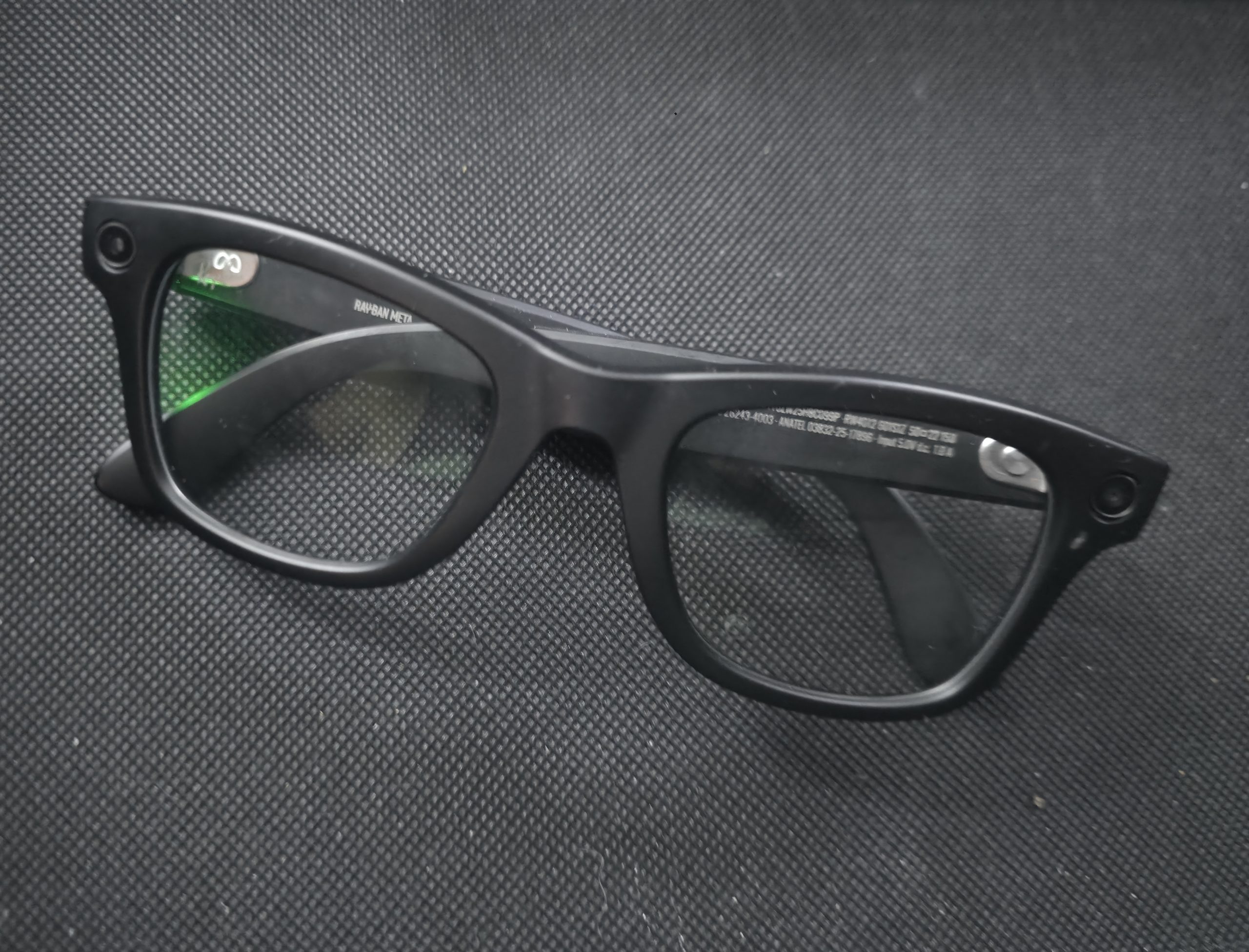 A pair of dead smart glasses lying in a drawer.